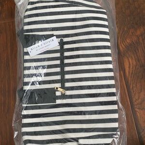 Black and White Striped Duffle Bag. New with tags, not opened